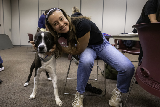 Smiling for a photo with Pinto the dog